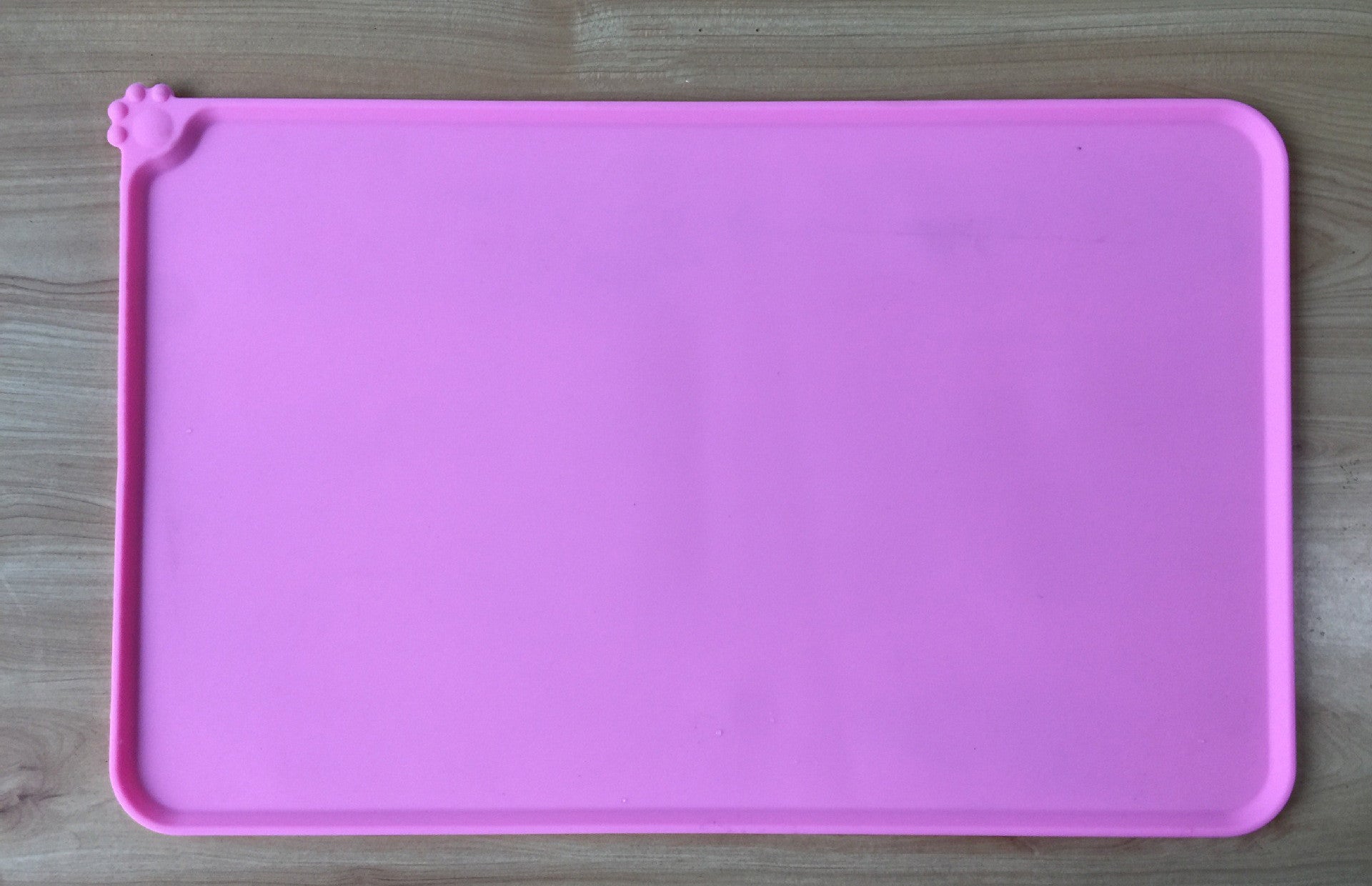 Close-up of textured surface on silicone pet feeding mat for easy cleaning  