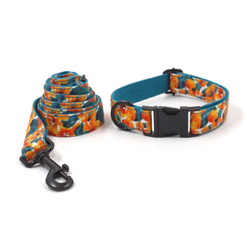 Rolled tropical floral dog leash and adjustable collar shown separately on white background