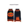 Load image into Gallery viewer, Black dog sweater with large smiling pumpkin design and orange trim
