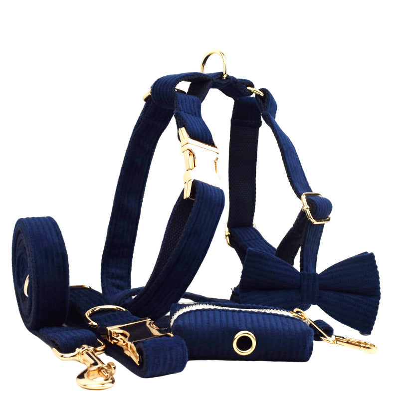 Complete navy blue corduroy dog collar, leash, harness, bow tie, and poop bag holder set with gold hardware