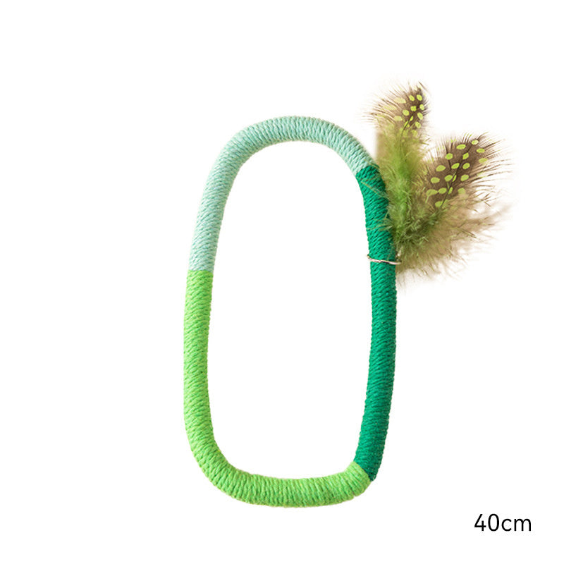 Green shades cotton rope catnip toy with feather decoration, 40cm length displayed