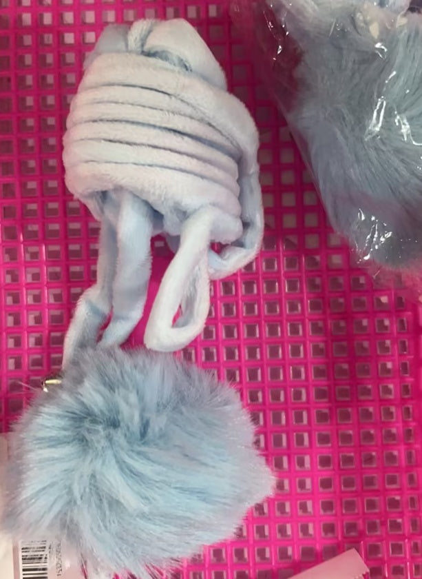 Close-up of light blue spring rabbit hair ball cat toy coiled