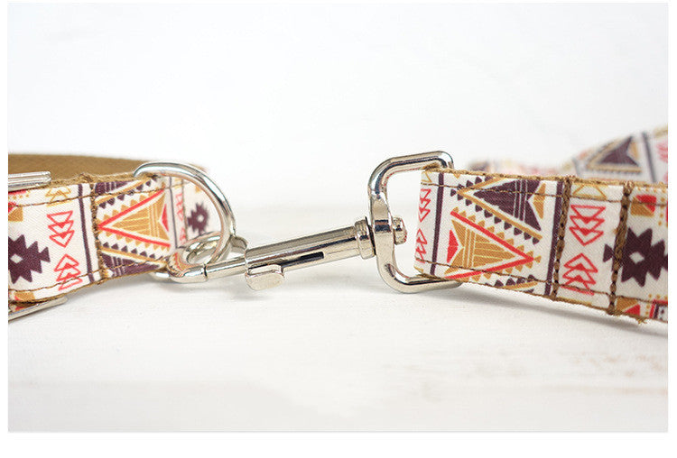 Metal clasp connecting dog leash to collar with fabric