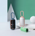 Load image into Gallery viewer, Two portable pet poop bag dispensers in pink-blue and white-pink with pet waste bags next to them
