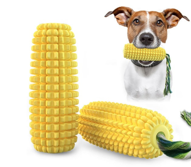 Brown and white dog biting yellow corn chew toy with rope