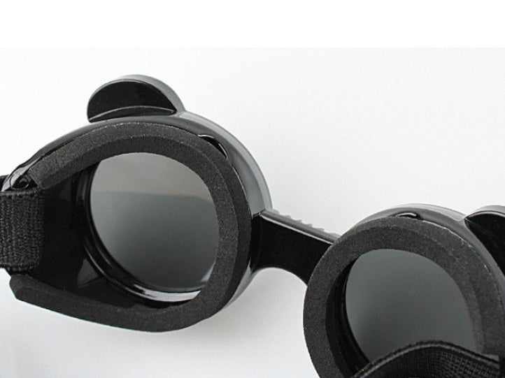 Showing flexibility and foam padding inside black pet goggles