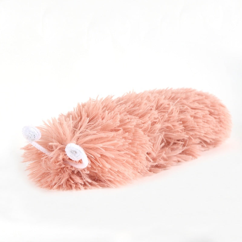 Close-up of pink caterpillar plush cat toy against white background
