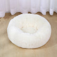 Load image into Gallery viewer, Cream-colored deep plush pet bed with thick fluffy sides placed on wooden floor

