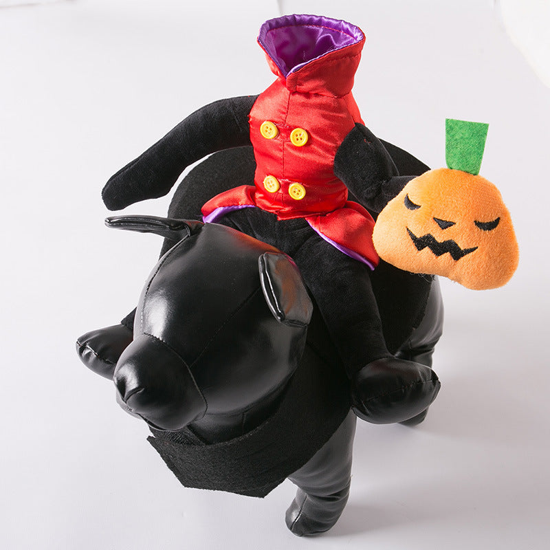 Side view of black faux leather dog model wearing the headless man costume, showing full body plush figure with pumpkin plush