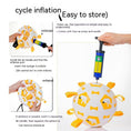 Cargar la imagen en la vista de la galería, Close-up showing inflation of white and yellow dog toy ball using a pump needle
