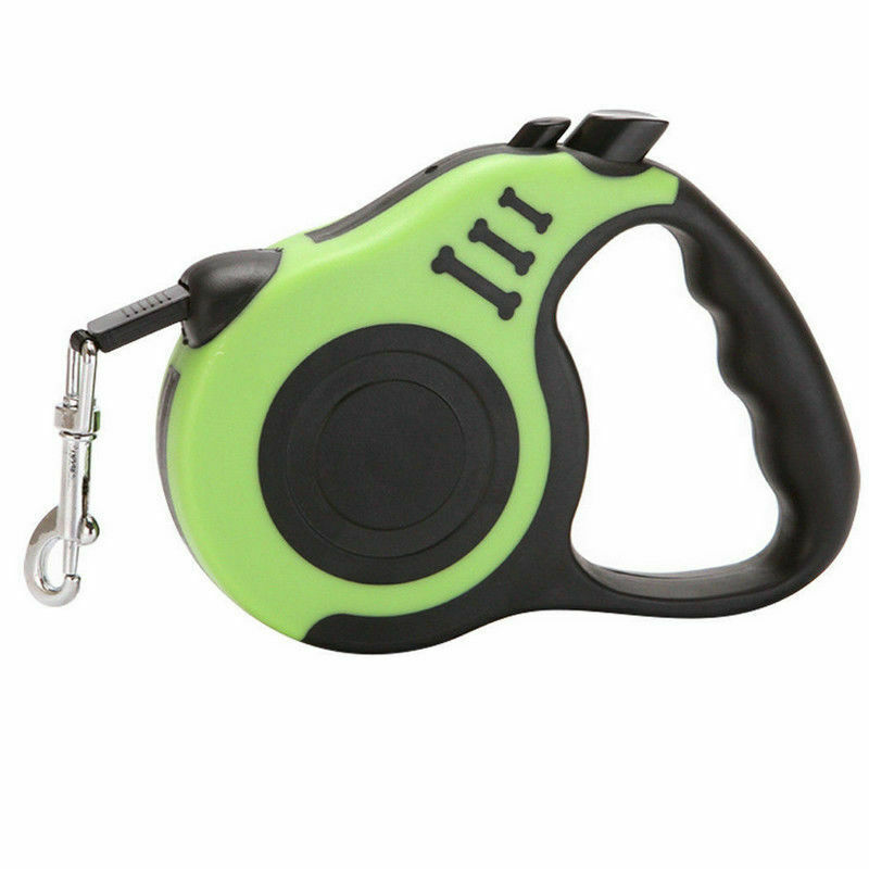 Close-up side view of green automatic retractable dog leash showing ergonomic handle and locking buttons