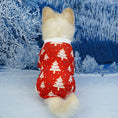 Charger l'image dans la visionneuse de la galerie, Small dog from behind showcasing red pajamas with white Christmas tree designs seated on a snowy winter scene
