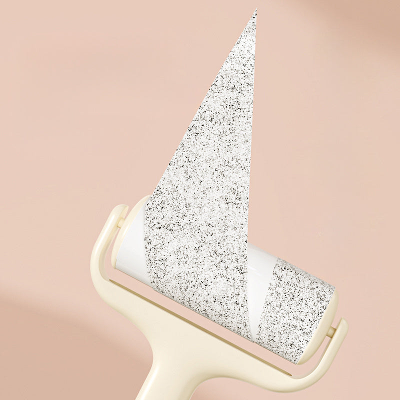Close-up of sticky roller paper peeling to show adhesive surface