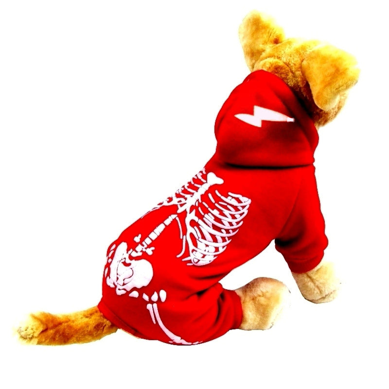 Small dog model wearing red skeleton print hooded jumpsuit with lightning bolt design on hood