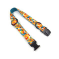 Load image into Gallery viewer, Close-up of adjustable tropical floral dog collar with black buckle and D-ring, vibrant orange and teal flowers
