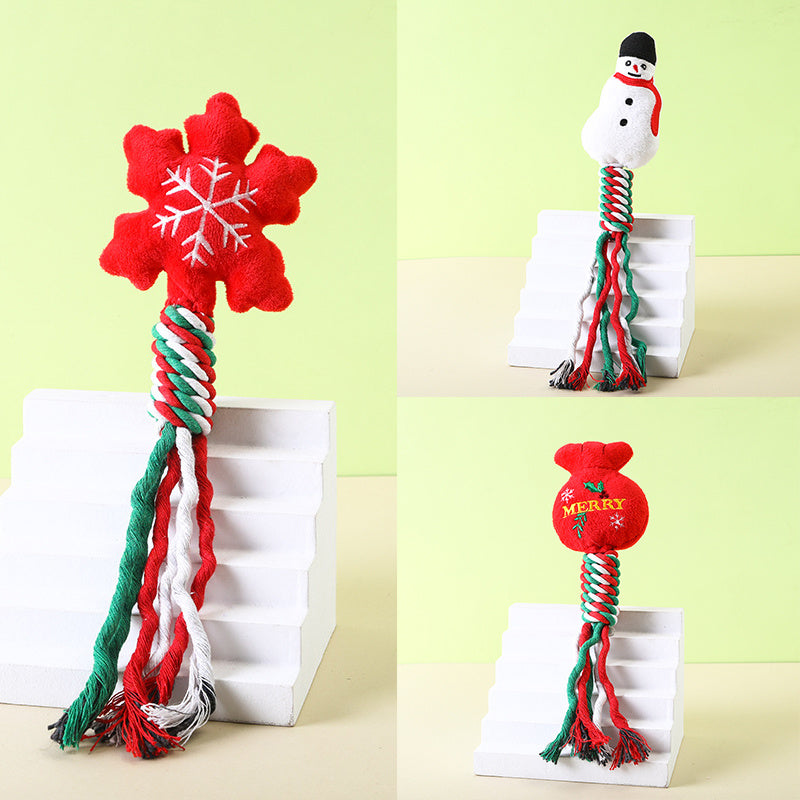 Individual images of two dog toys displayed on block stands: snowflake and snowman plush holiday toys