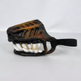 Charger l'image dans la visionneuse de la galerie, Close-up side view of the vampire teeth dog muzzle with realistic teeth and adjustable black elastic strap on white background
