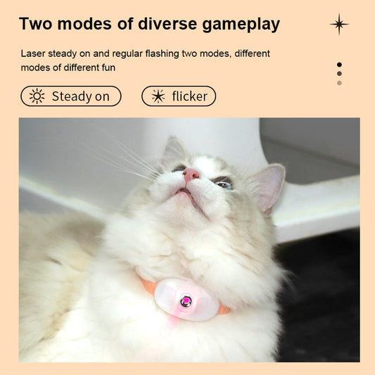 White cat with peach laser collar looking up at flickering laser
