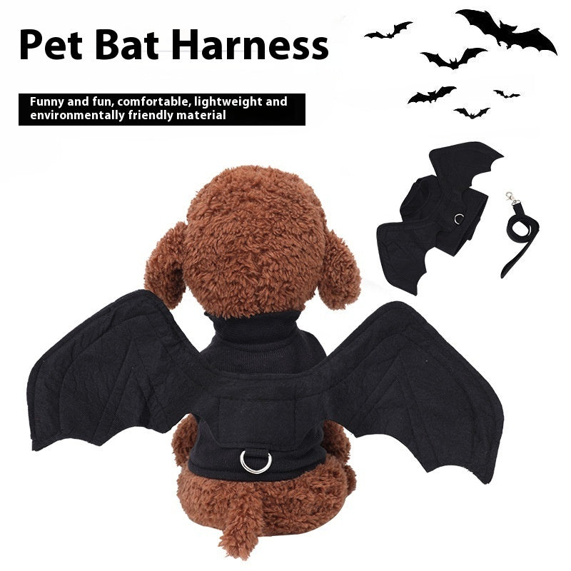 Brown plush toy dog wearing a black pet bat harness with quilted bat wings attached on back and collar leash alongside harness displayed