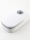 Charger l'image dans la visionneuse de la galerie, Single white automatic pet feeder with mechanical timer dial and paw-print embossed lid, shown on white background
