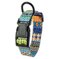Load image into Gallery viewer, Close-up of black plastic buckle and D-ring on vibrant yellow, blue, and green patterned collar
