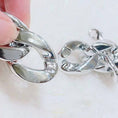 Load image into Gallery viewer, Close-up of silver plastic chain link detail with clasp
