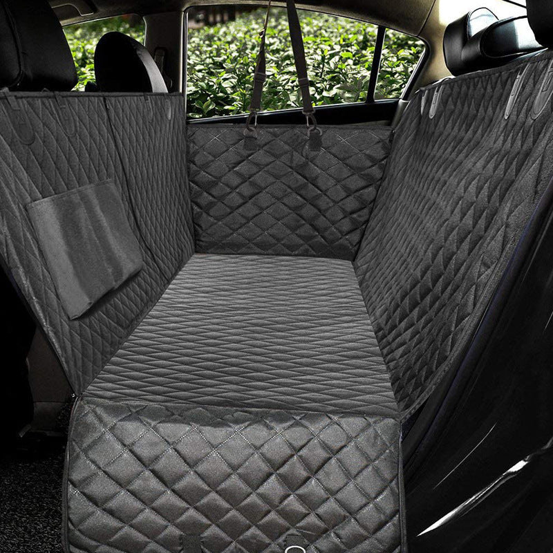 Black quilted waterproof dog car seat cover fully installed protecting rear seat and door panel