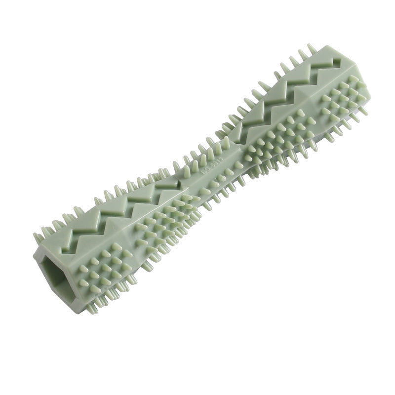 Pink rubber dog chew toy with zigzag groove and textured bristles