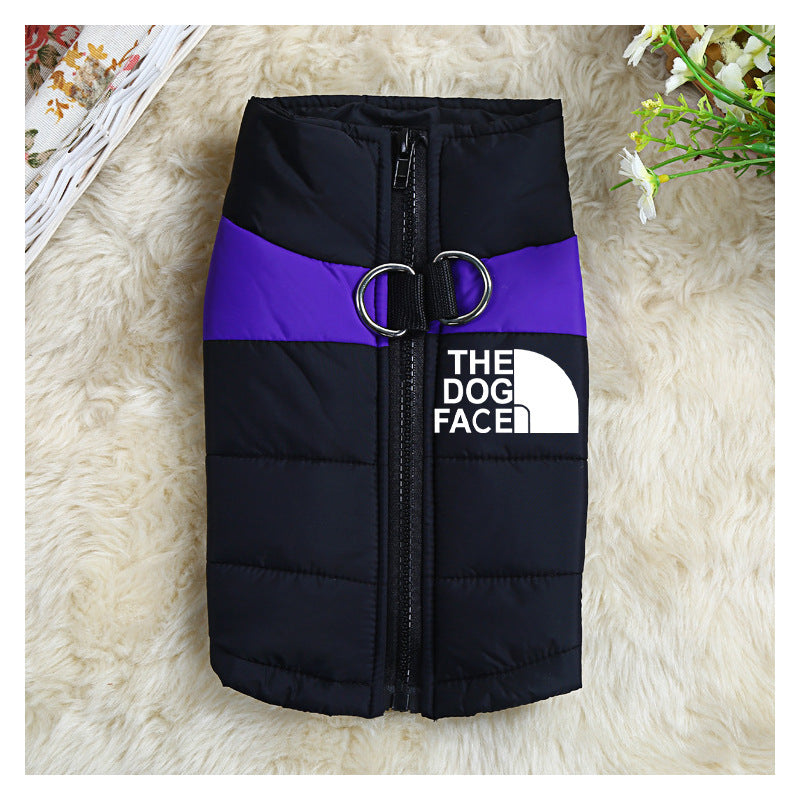 Folded black and purple waterproof dog vest with dual leash D-rings, displayed on soft cream surface with flowers