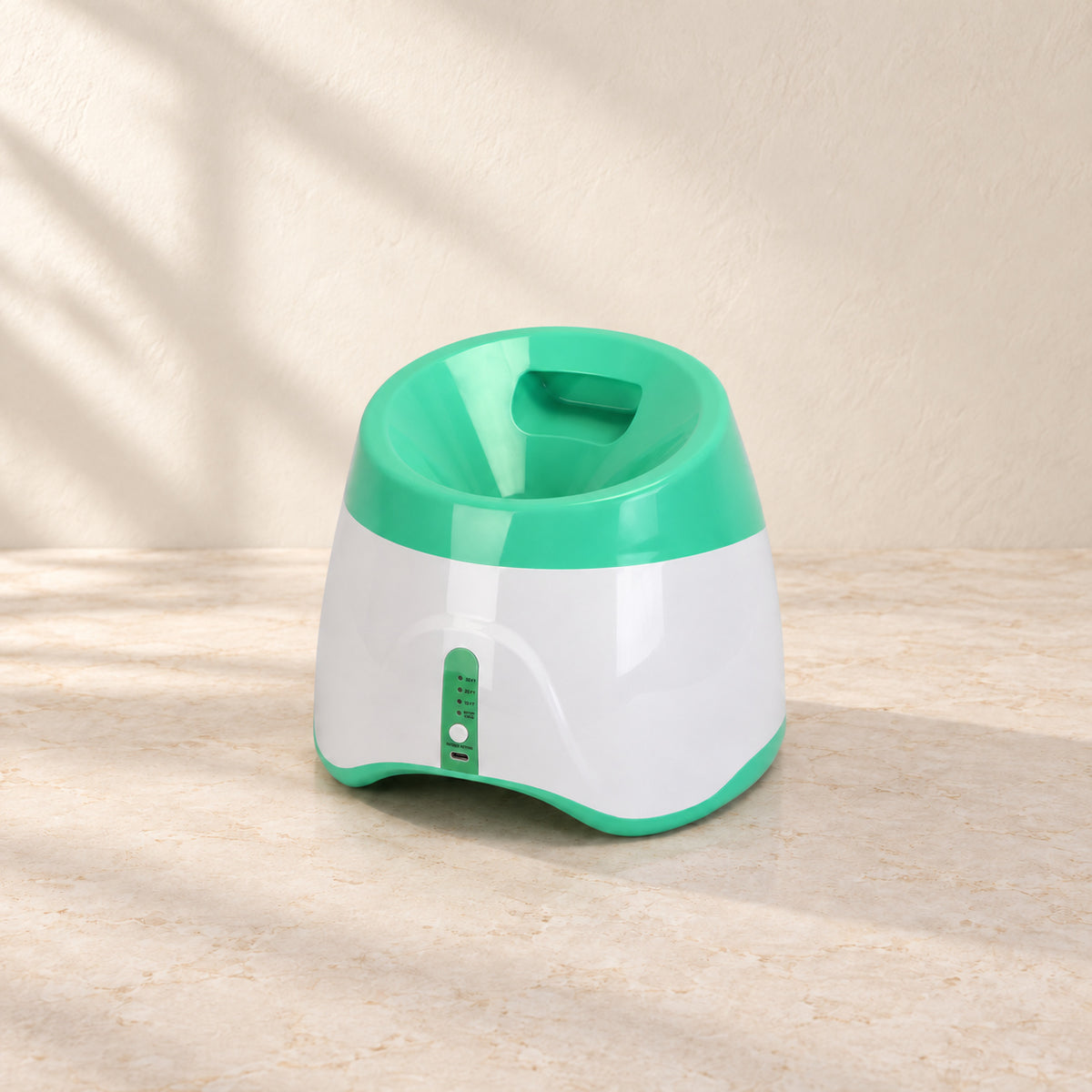 Rear view of green automatic dog ball launcher with loading hopper and controls