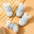 Load image into Gallery viewer, Two light blue fleece-lined dog booties with rubber soles positioned on yellow plaid fabric

