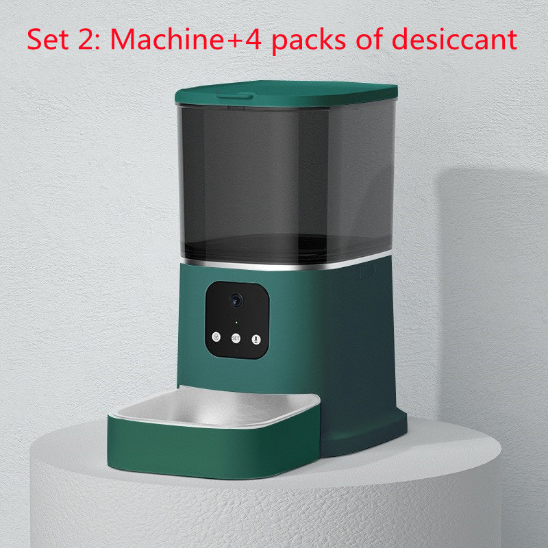 Green smart pet feeder with text showing set includes machine and 4 desiccant packs