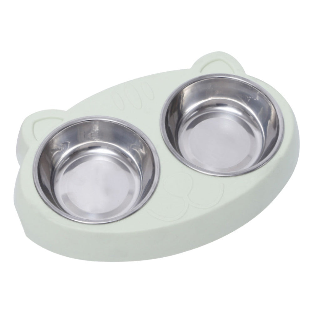 Angled view of pale green cat-shaped double bowls with stainless steel inserts in place