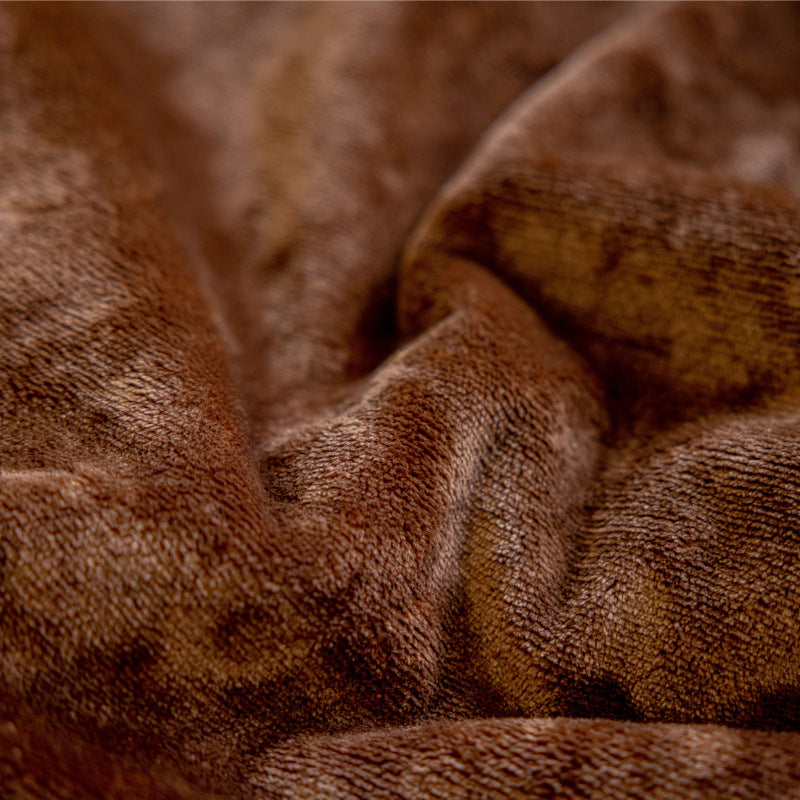 Close-up texture of the plush brown flannel fabric showing soft, fluffy material