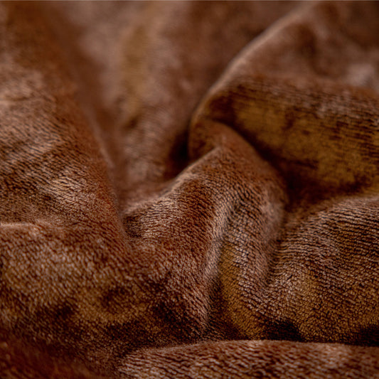 Close-up texture of the plush brown flannel fabric showing soft, fluffy material