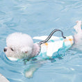 Load image into Gallery viewer, Small white dog wearing a multi-color checkered floatation life vest with handle swimming in pool
