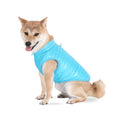 Cargar la imagen en la vista de la galería, Shiba Inu dog wearing a bright blue padded nylon quilted jacket with zipper and leash loop sitting on white background
