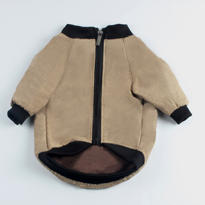 Khaki and black dog jacket laid flat showing rear zipper and elastic cuffs