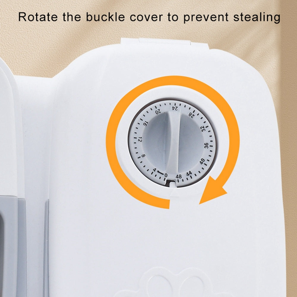 Close-up of mechanical timer dial with orange rotation arrow; feeding compartment cover prevents food stealing