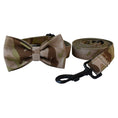 Load image into Gallery viewer, Camouflage dog collar with attached bow tie and matching rolled-up leash with black metal clip
