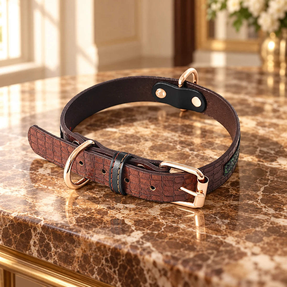 Coffee brown croc-texture dog collar with rose-gold buckle on brown marble