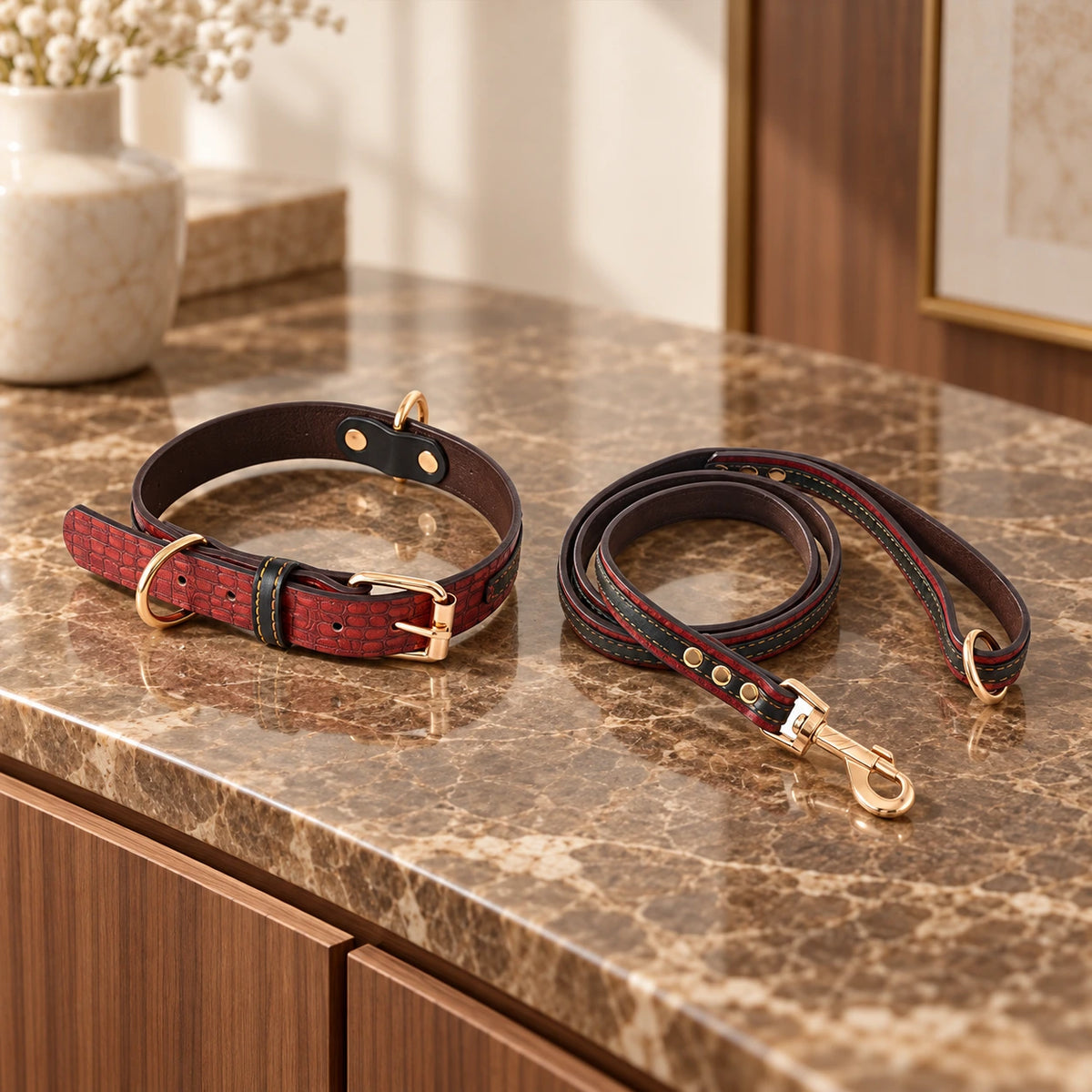 Red croc-texture collar and matching red-edged leash on brown marble