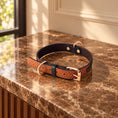 Cargar la imagen en la vista de la galería, tan collar with rose-gold hardware on brown marble
