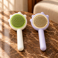 Load image into Gallery viewer, Pack of one green comb and one purple comb on brown marble
