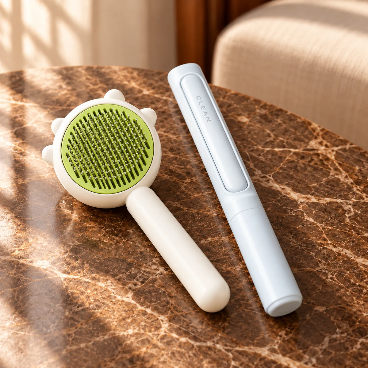 Green pet grooming comb and pale blue lint-removal tool on brown marble