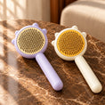Load image into Gallery viewer, Pack of one purple comb and one yellow comb on brown marble
