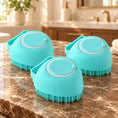 Load image into Gallery viewer, Three turquoise smooth-bodied silicone pet bath brushes on brown marble
