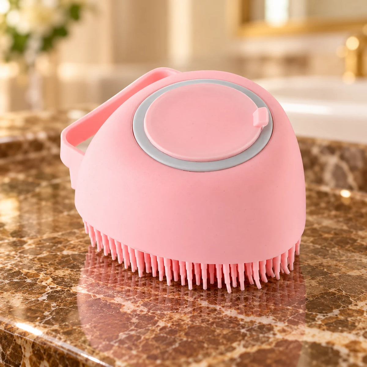 Pink silicone pet bath brush with smooth body and refill cap on brown marble
