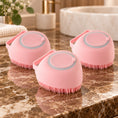 Load image into Gallery viewer, Three pink smooth-bodied silicone pet bath brushes on brown marble
