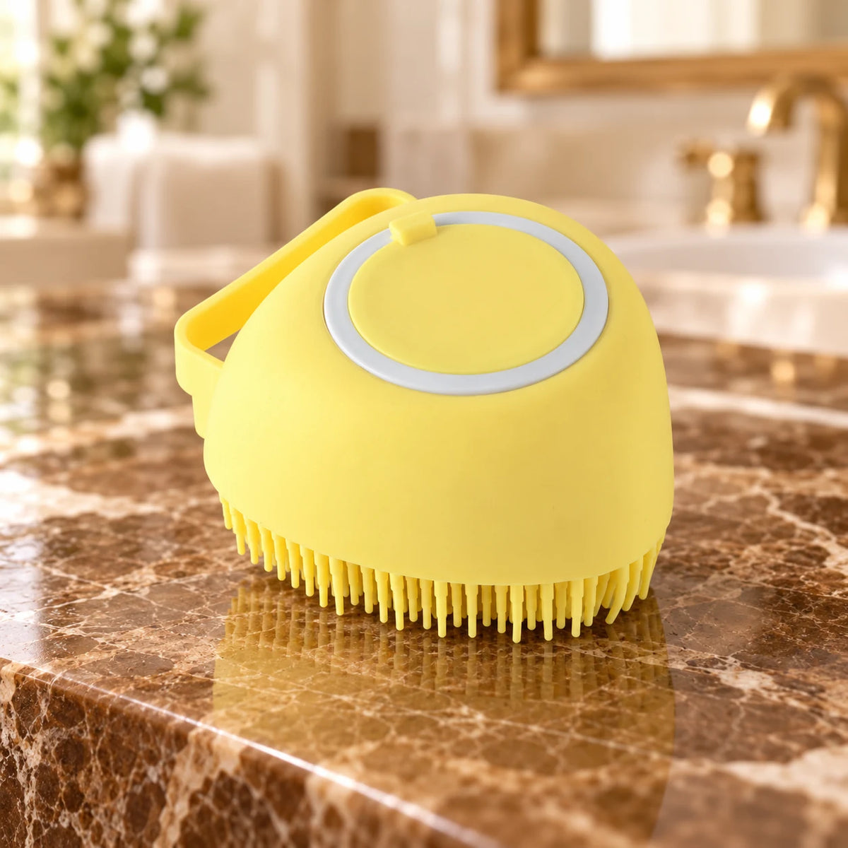 Yellow silicone pet bath brush with smooth body and refill cap on brown marble